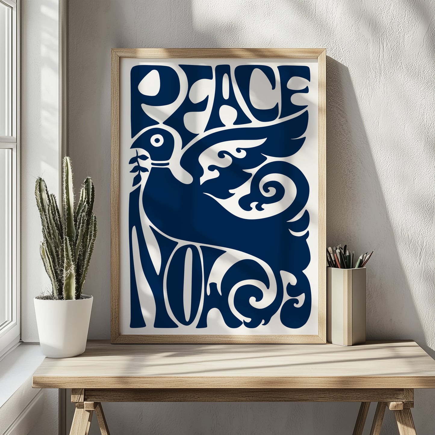 Peace Now poster op een houten tafel staand tegen een muur