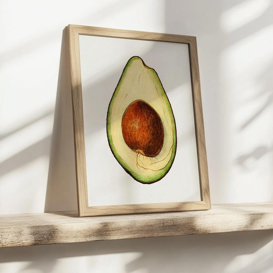 Ingelijste avocadoposter op houten plankje met zonnestralen – warme, natuurlijke sfeer.