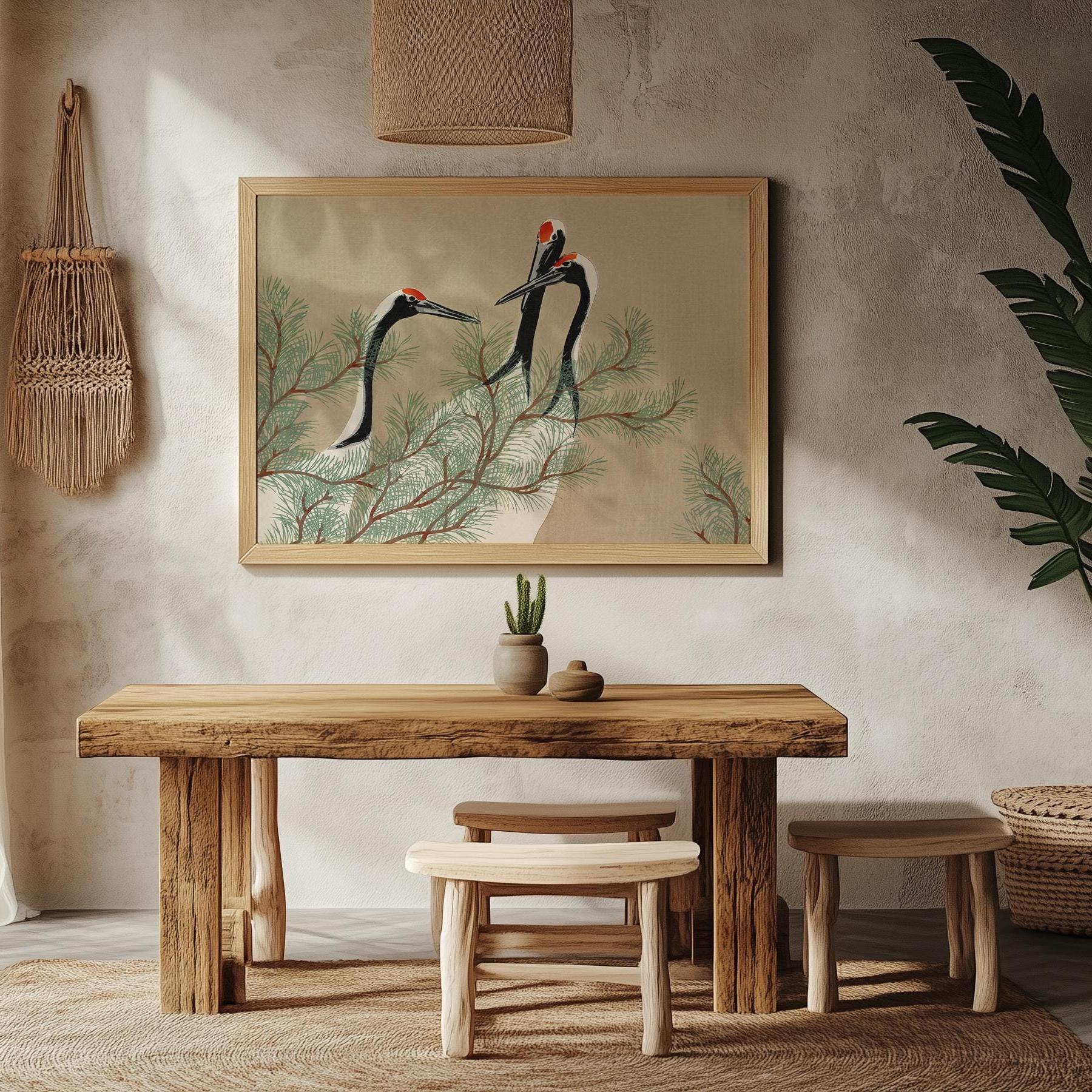 Japanese cranes poster on a wall in a dining room with wooden furniture