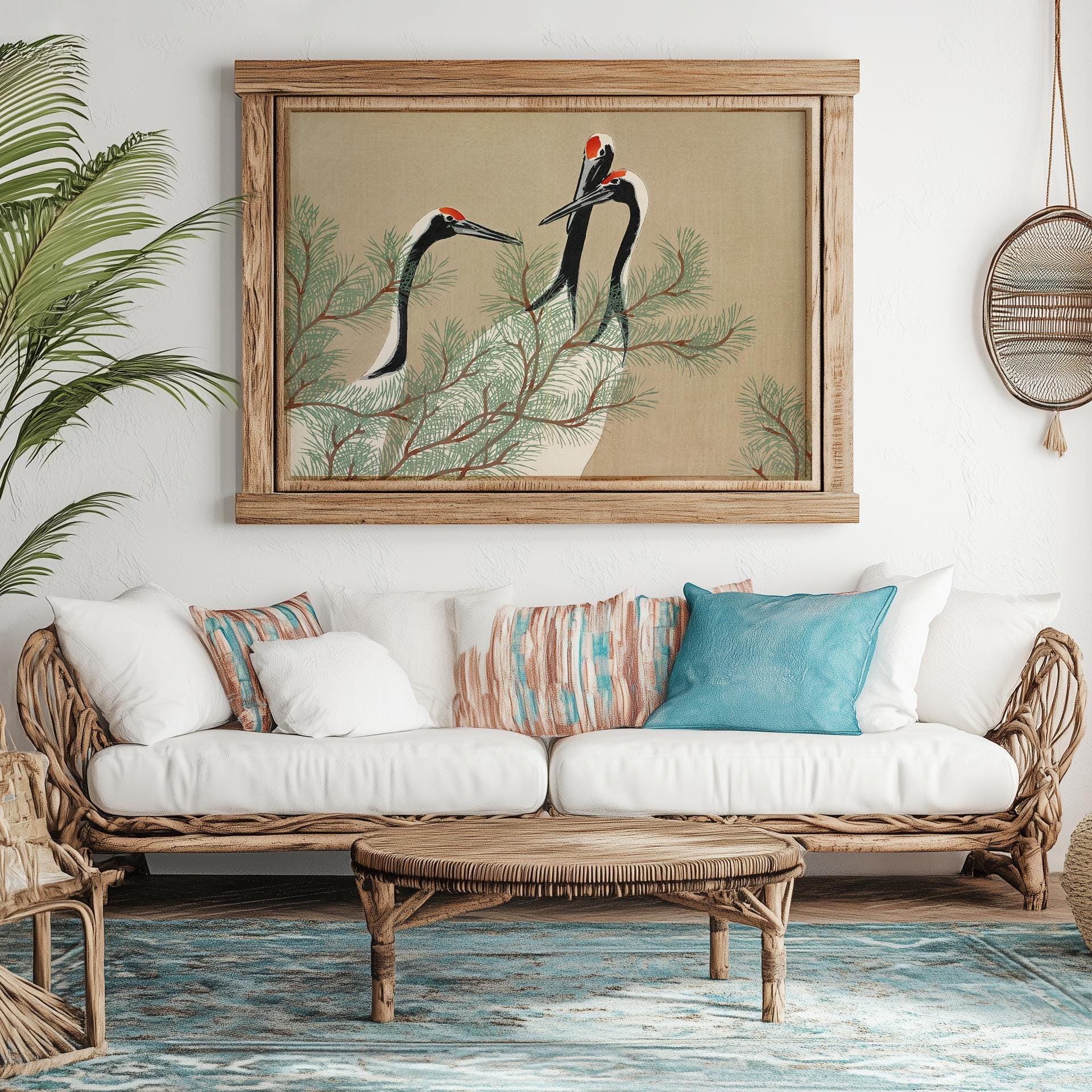 japanese cranes poster on a wall in a room with a couch